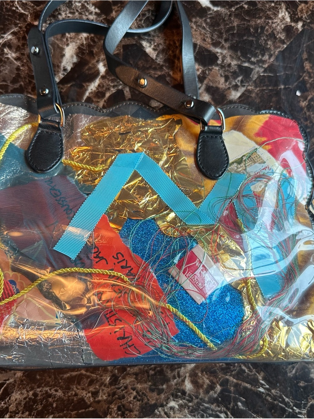 Super unique.  Multi media Christian Louboutin Black Handles